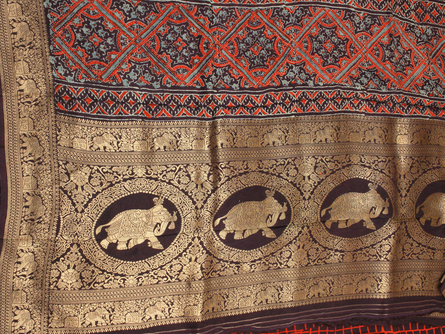 Pure Dola Silk Saree with wooden hand block Ajrakh Prints on Navy blue saree